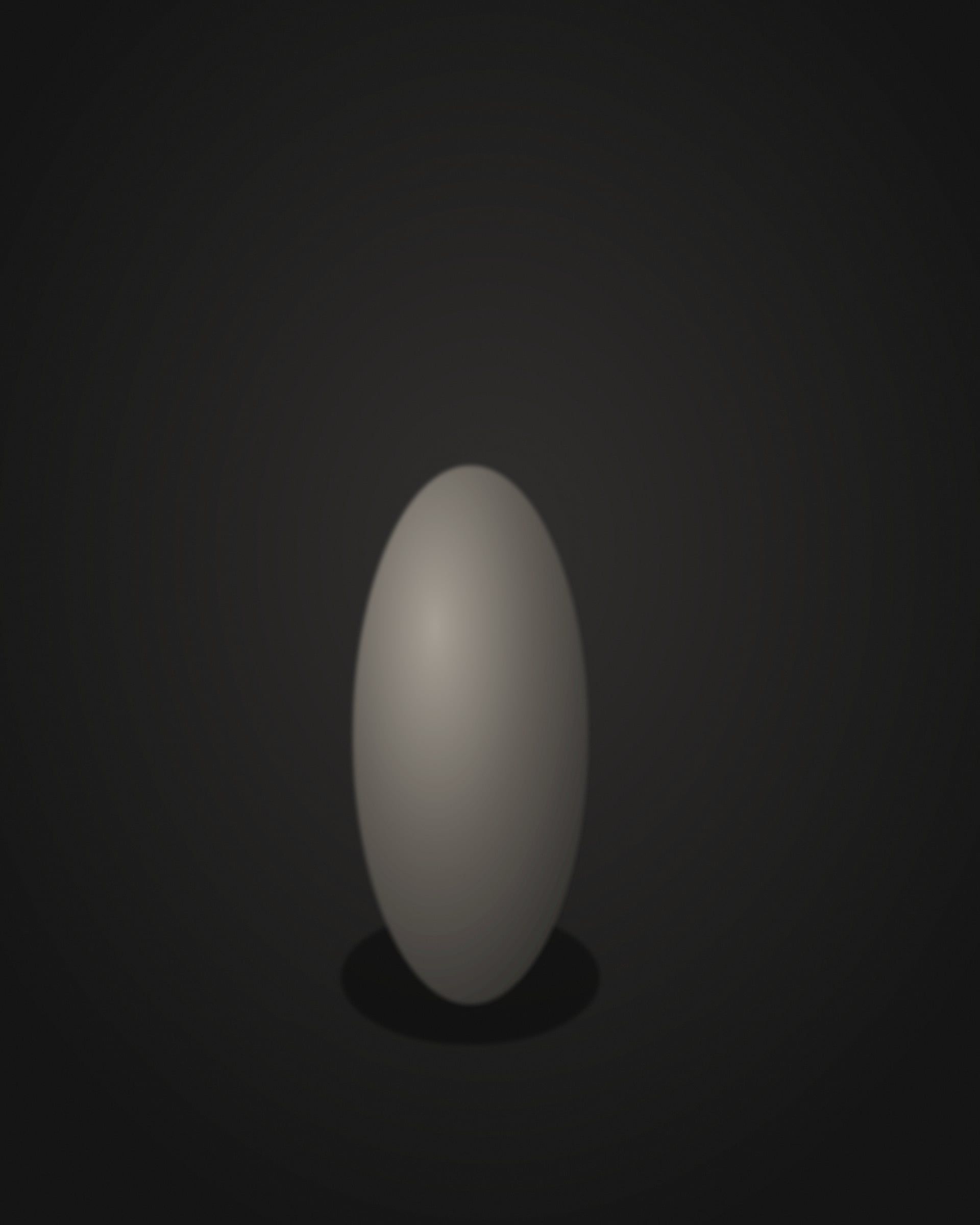 The object seen from a low angle, standing upright against darkness.